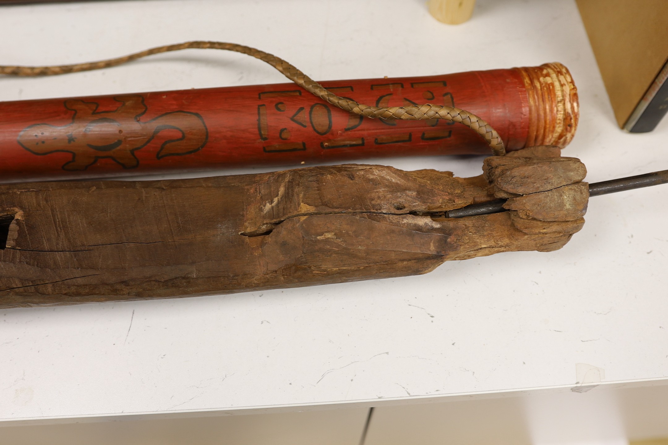 A Chinese wood grave figure possibly Han, 85.5cm high, with wooden musical rain stick